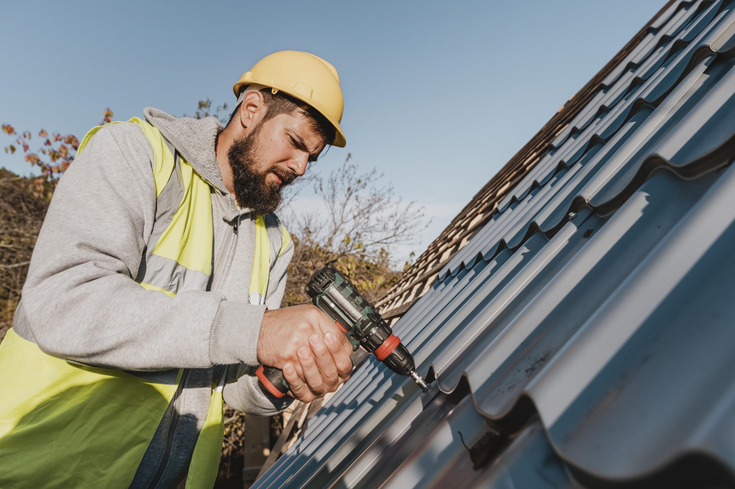Professional roofer carrying out repairs on a UK residential roof